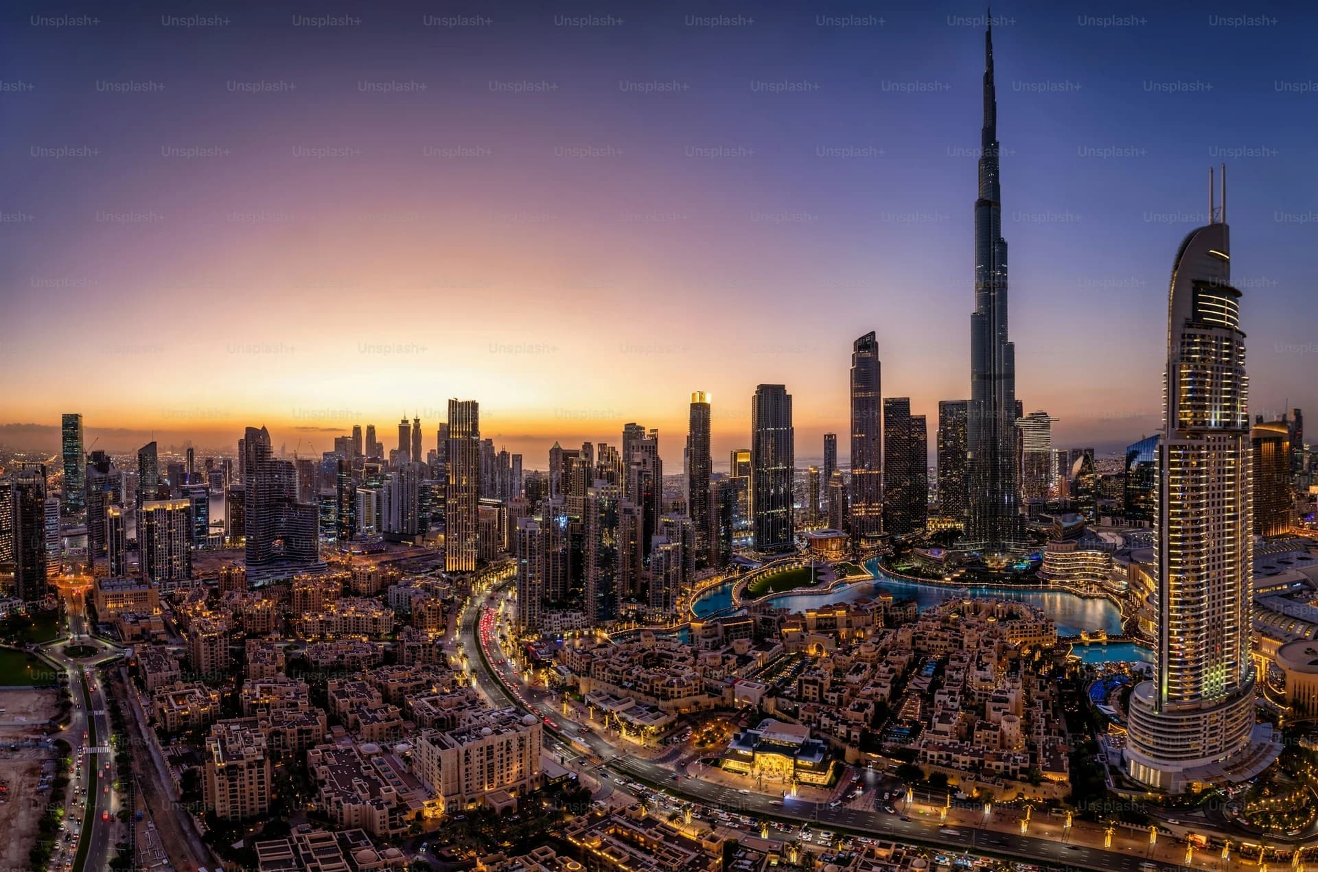 Dubai skyline at dusk. Deep navy wash.