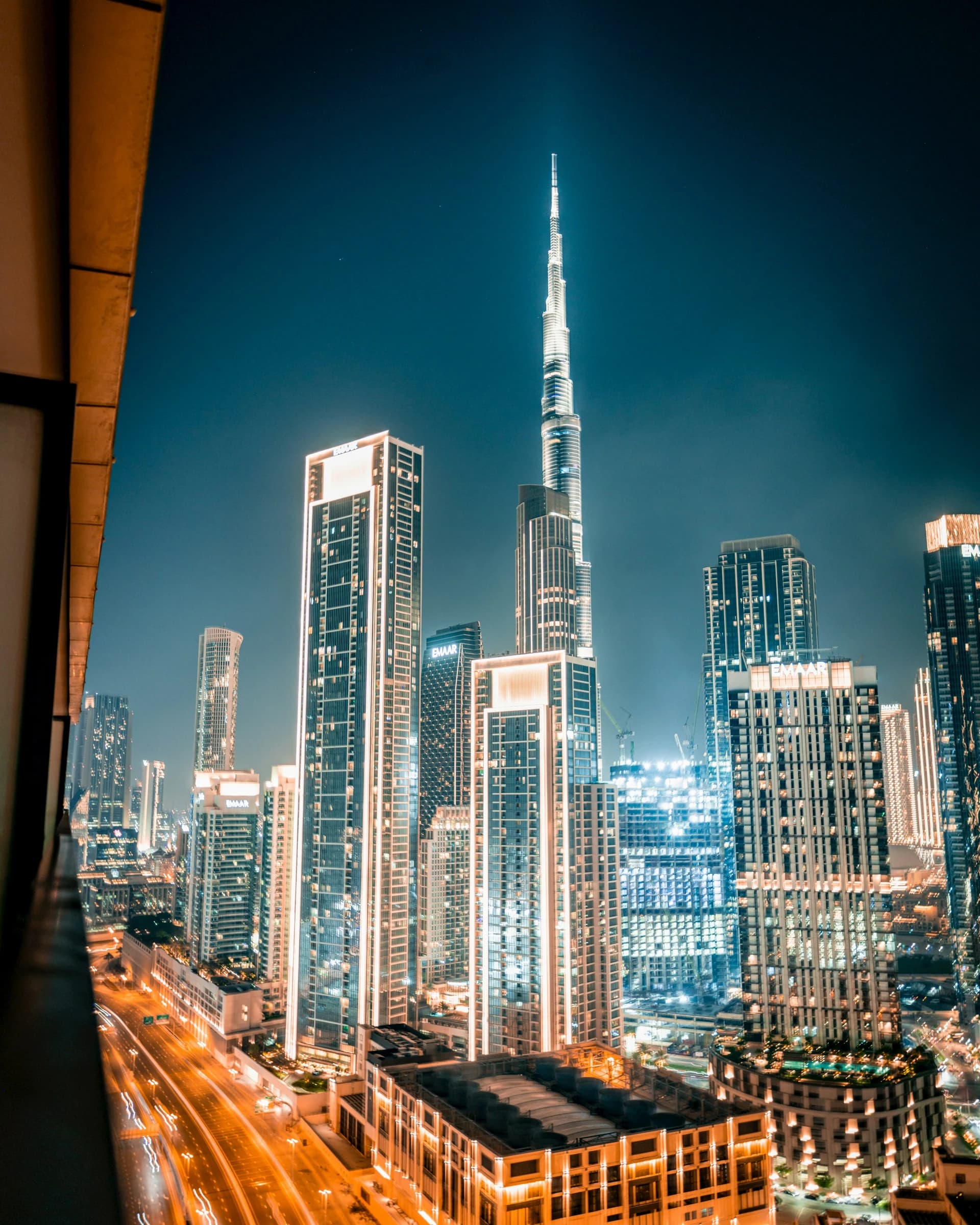 Dubai skyline at night with Burj Khalifa illuminated. Photo by Kevin Gyovai on Unsplash.