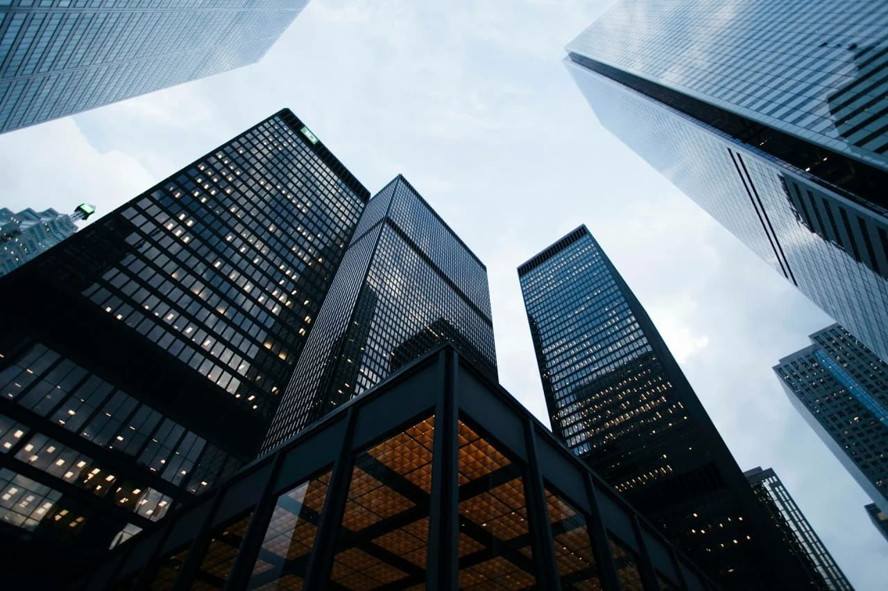 Glass facade of a modern commercial tower. Duotone texture for the integrated capability flagship.